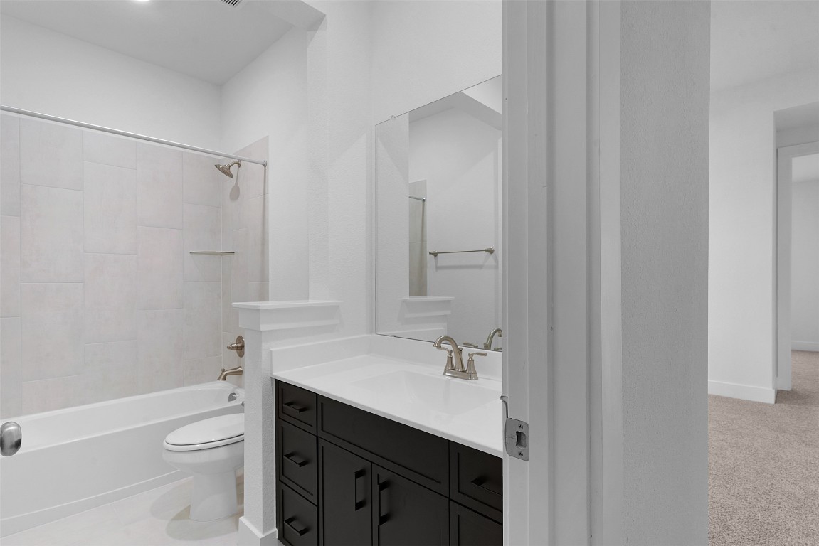 1129 Pansy Trail Georgetown, TX 78628 - Photo 5 of 28 a bathroom with a sink a toilet and shower