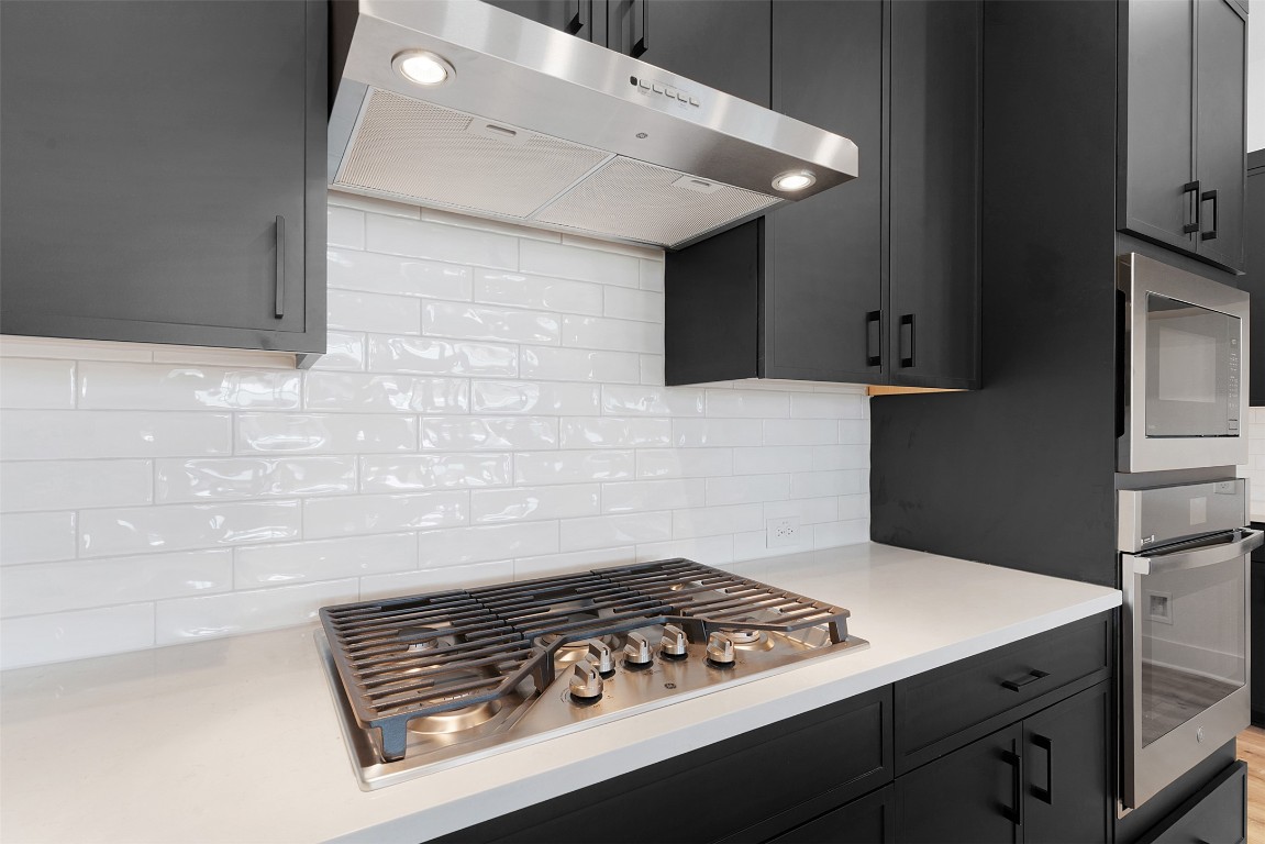 1129 Pansy Trail Georgetown, TX 78628 - Photo 10 of 28 a stove top oven sitting inside of a kitchen