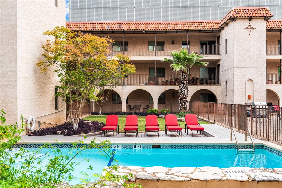 505 West 7th Street, Unit 313 Austin, TX 78701 - Photo 23 of 30 Pool featuring a patio and fence