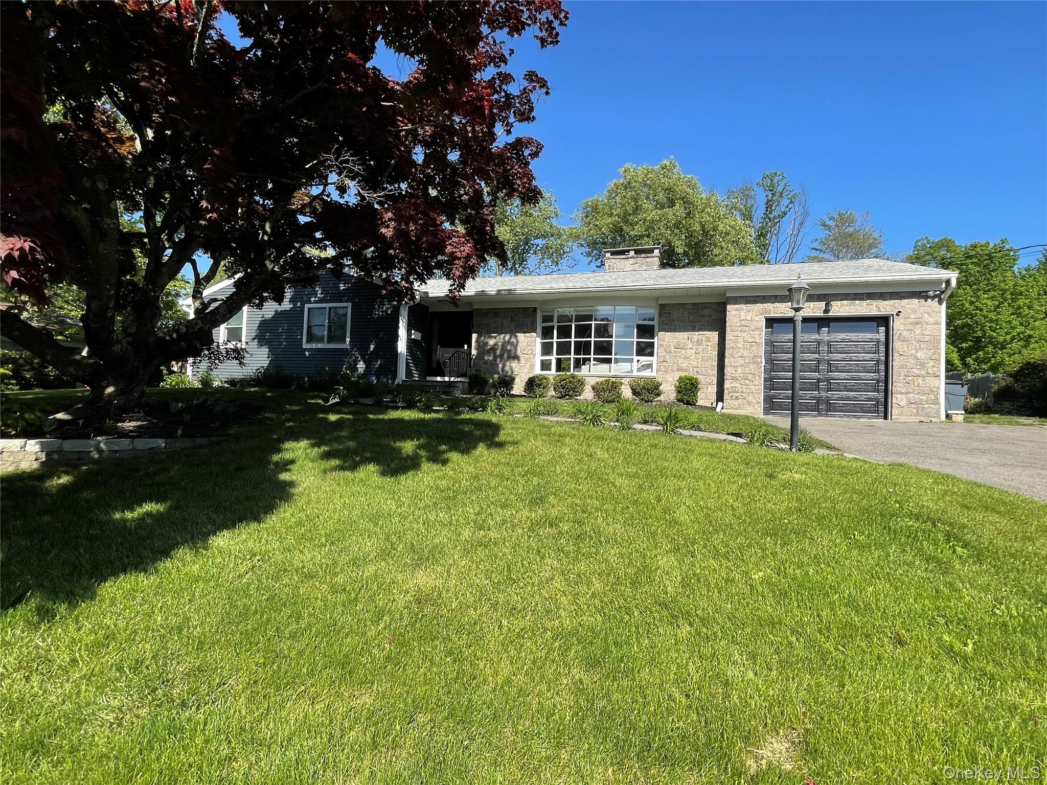 5 Paddock Road Rye Brook, NY 10573 - Photo 2 of 23 Front of home with new garage door