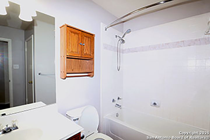 9827 Copperway Converse, TX 78109 - Photo 13 of 16 a bathroom with a bathtub and shower