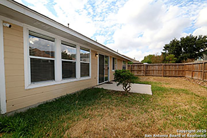 9827 Copperway Converse, TX 78109 - Photo 15 of 16 a view of house with backyard and sitting area