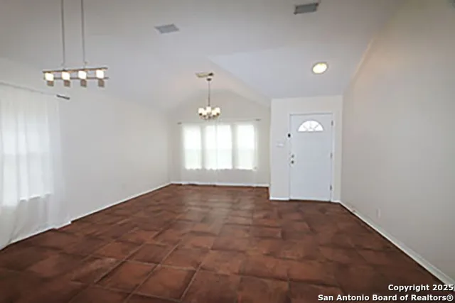a bedroom with a bed and a fireplace