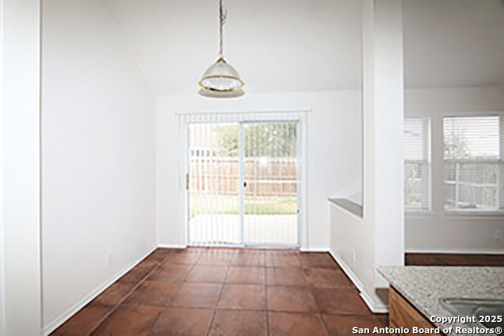 9827 Copperway Converse, TX 78109 - Photo 6 of 16 a view of an empty room with a window