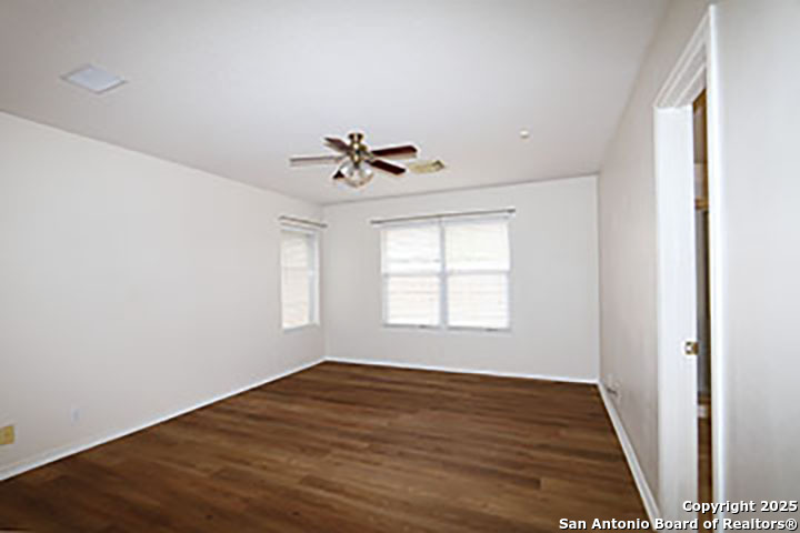 9827 Copperway Converse, TX 78109 - Photo 9 of 16 a view of empty room with wooden floor and fan