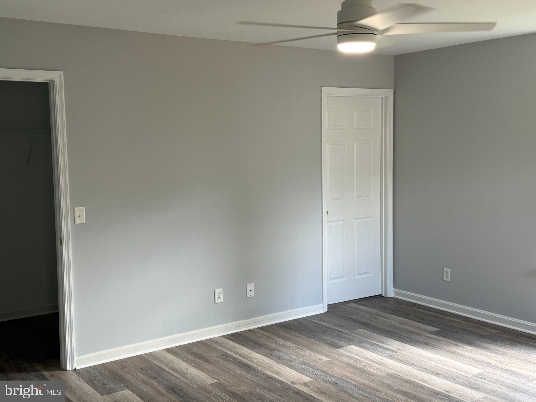 30952 Sandy Ridge Drive Lewes, DE 19958 - Photo 9 of 17 wooden floor in an empty room