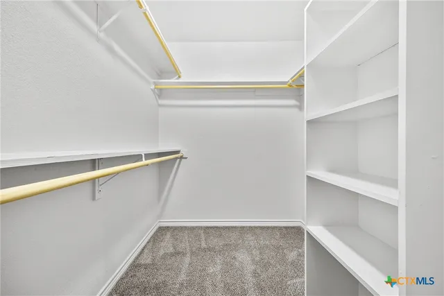 a view of an empty walk in closet