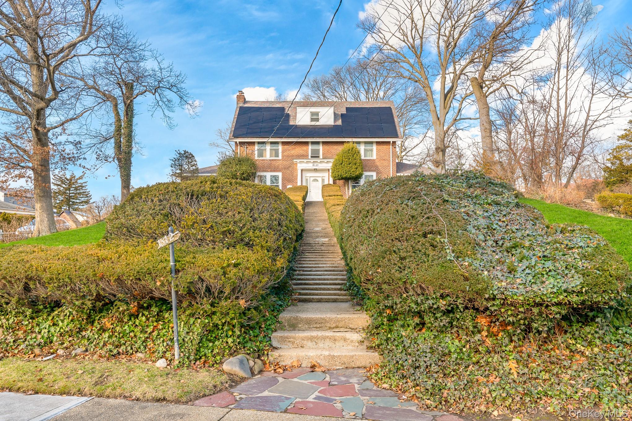 181-23 Henley Road Queens, NY 11432 - Photo 1 of 1 a front view of a house with a yard