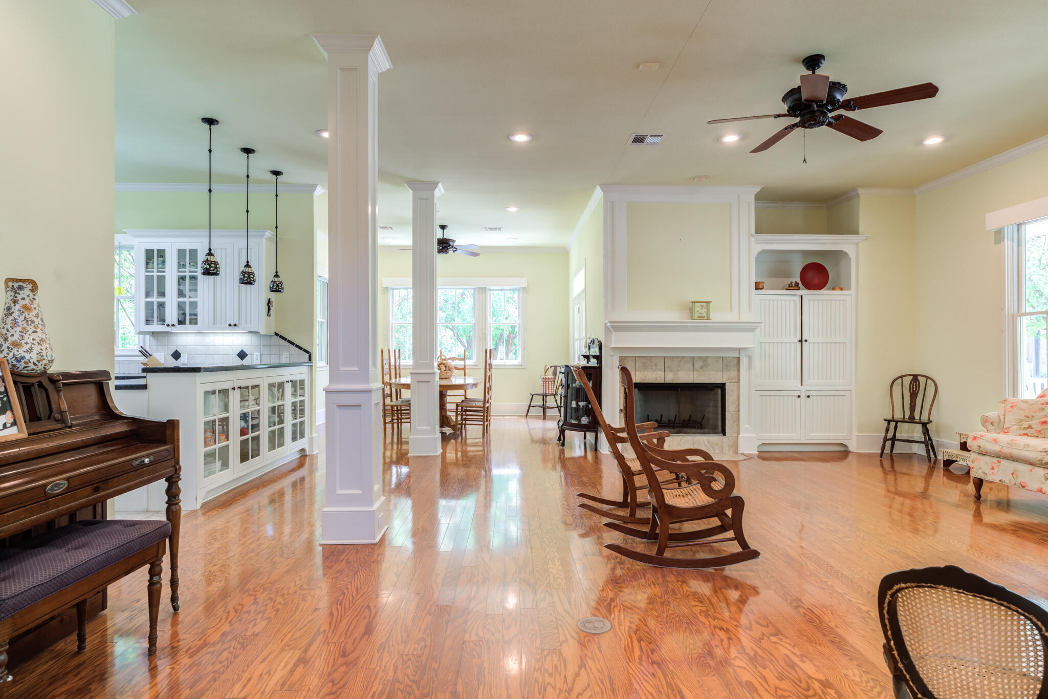 4709 116th Street Lubbock, TX 79424 - Photo 17 of 58 a living room with furniture a fireplace and a chandelier
