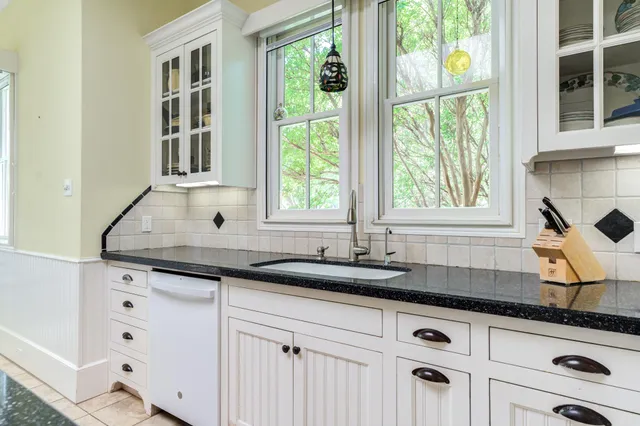 a living room with furniture window and wooden floor