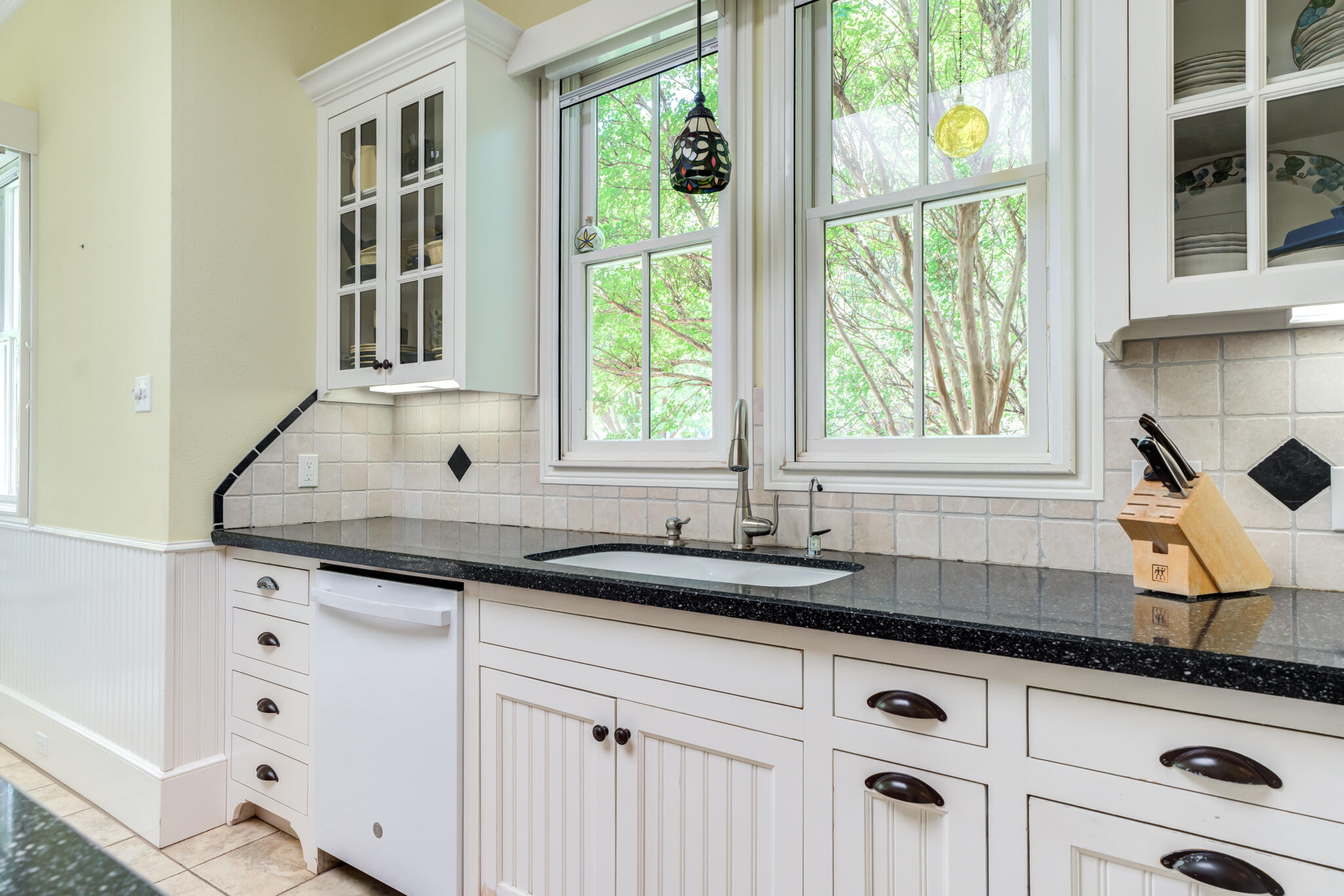 4709 116th Street Lubbock, TX 79424 - Photo 28 of 58 a kitchen with granite countertop a sink and a window