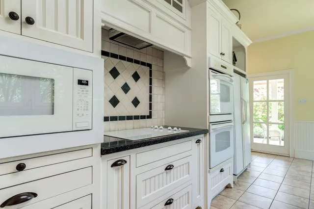 a large en suite bathroom with a tub sink and mirror