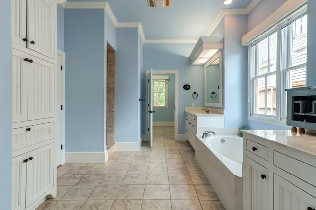 a room that has a sink and a chair in it