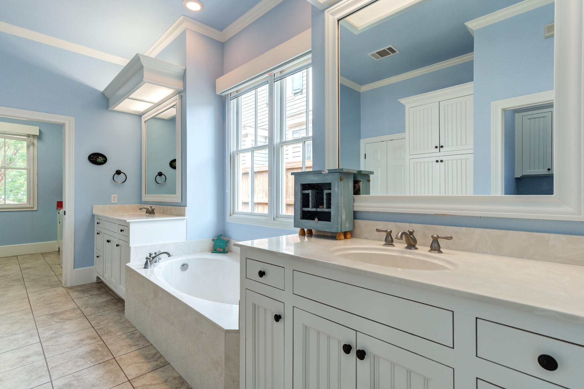 4709 116th Street Lubbock, TX 79424 - Photo 36 of 58 a bathroom with a tub sink and mirror
