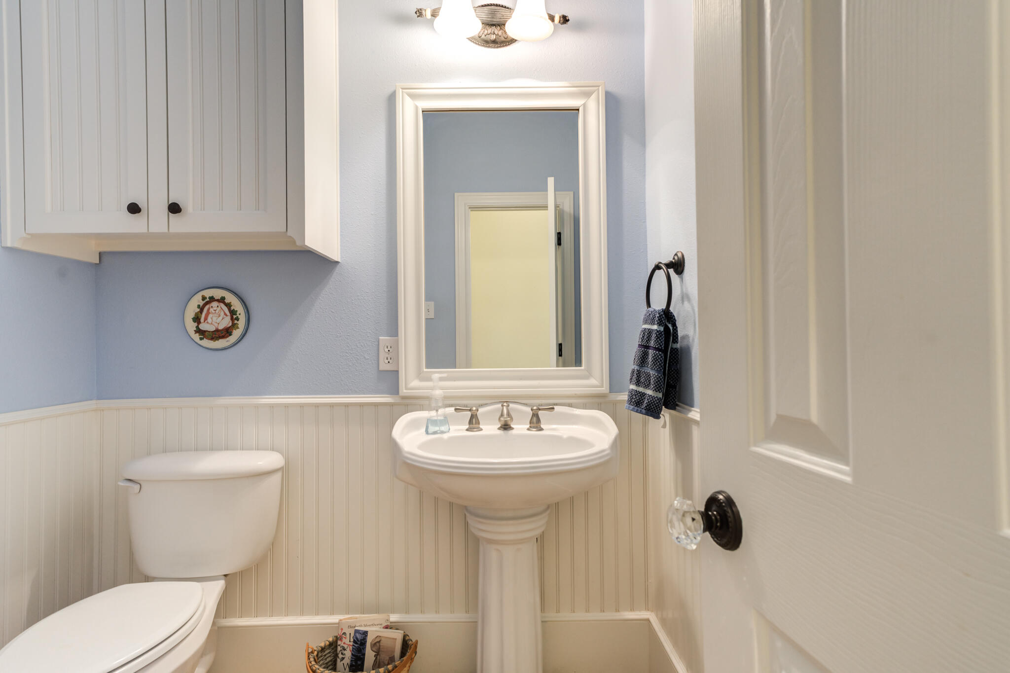4709 116th Street Lubbock, TX 79424 - Photo 39 of 58 a bathroom with a sink a toilet and mirror