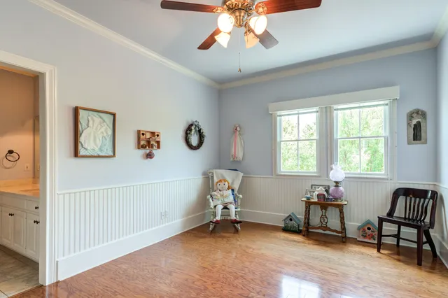 a view of a chairs and table in patio with wooden fence