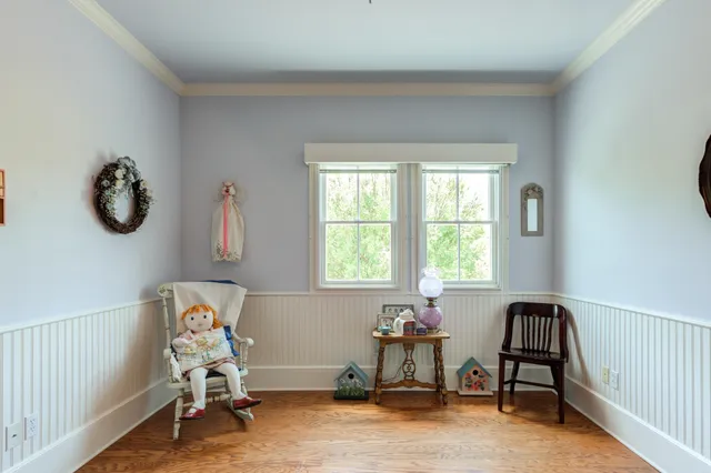 a front view of a house with outdoor seating