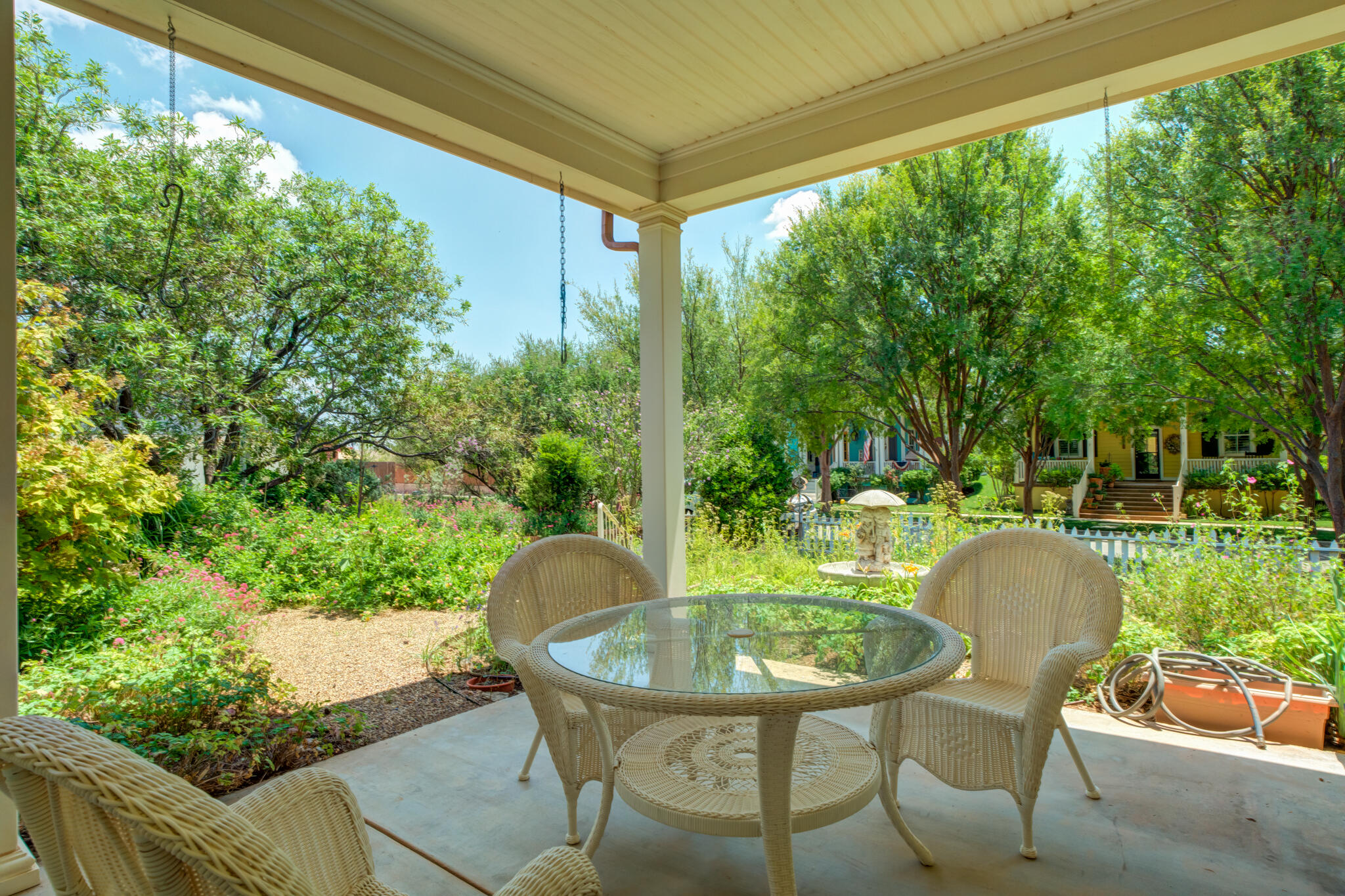 4709 116th Street Lubbock, TX 79424 - Photo 52 of 58 a view of a chairs and table in patio with wooden fence
