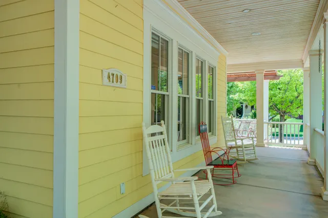 a view of a wooden deck next to a yard