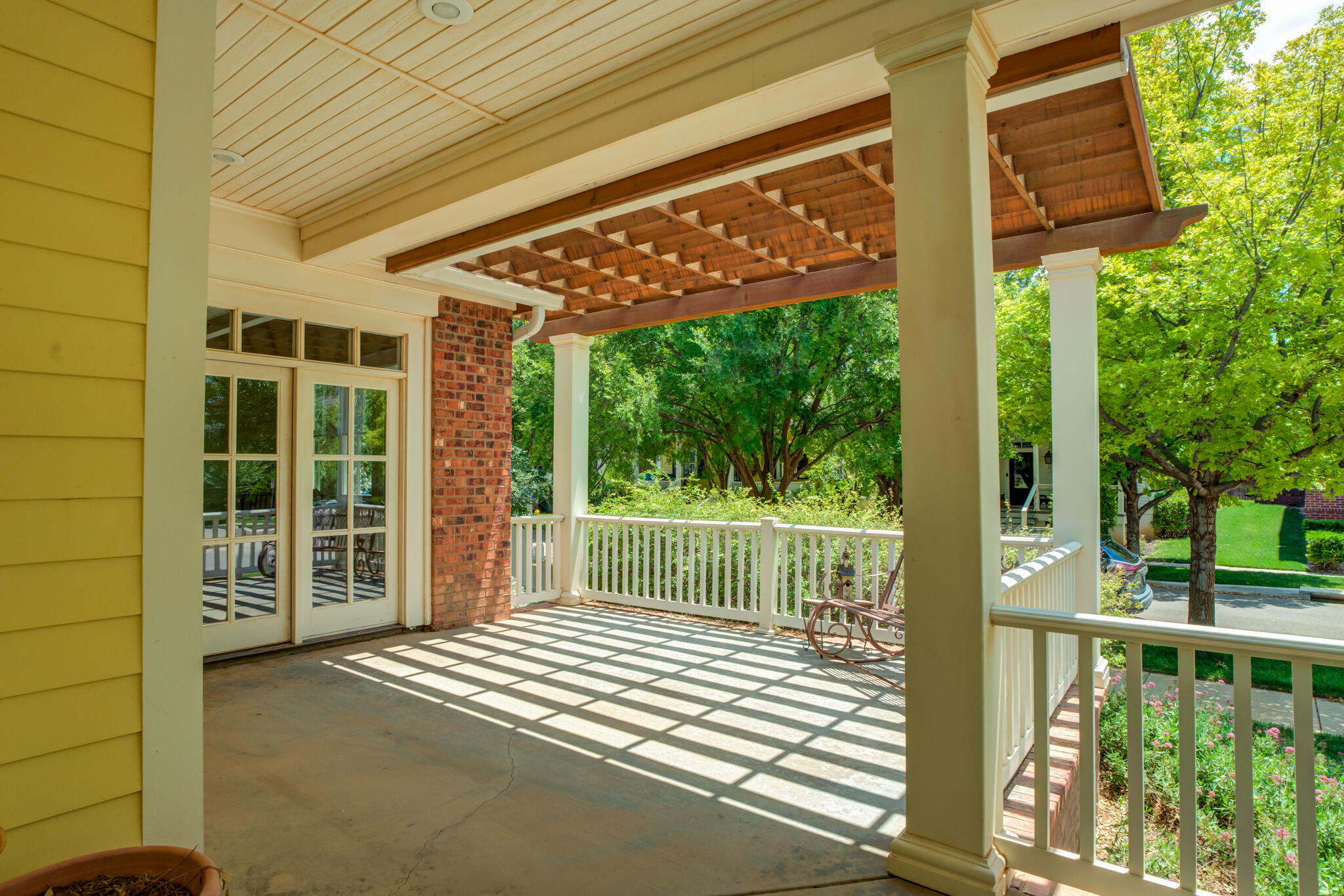 4709 116th Street Lubbock, TX 79424 - Photo 8 of 58 a view of a porch with wooden floor and fence