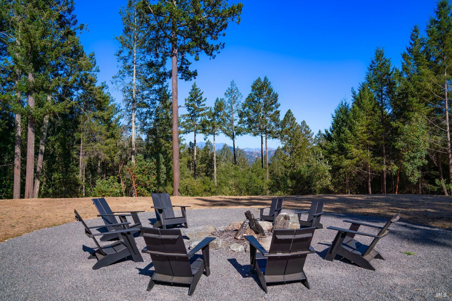 1260 Emerald Ranch Road Healdsburg, CA 95448 - Photo 2 of 10 a view of a patio with chairs and a table
