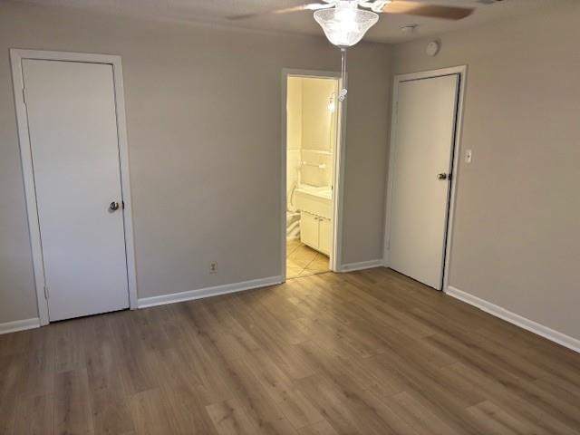 852 West Redbud Drive Hurst, TX 76053 - Photo 2 of 6 an empty room with wooden floor and windows