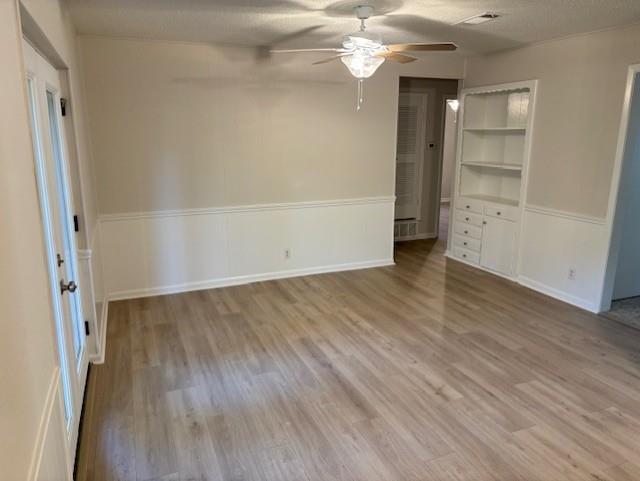 852 West Redbud Drive Hurst, TX 76053 - Photo 5 of 6 an empty room with wooden floor and windows