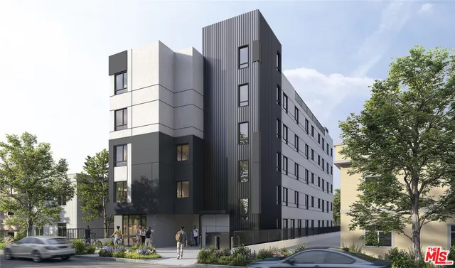 a city street lined with buildings and trees