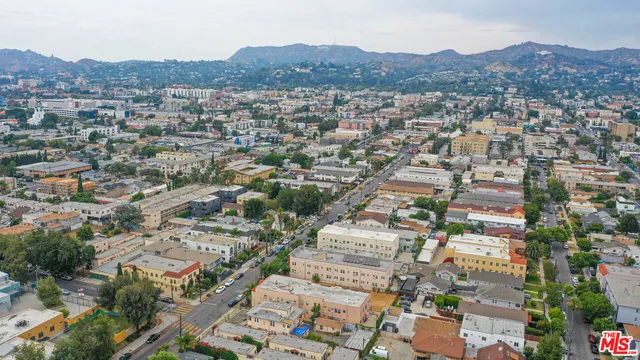 an aerial view of residential house and sandy dunes