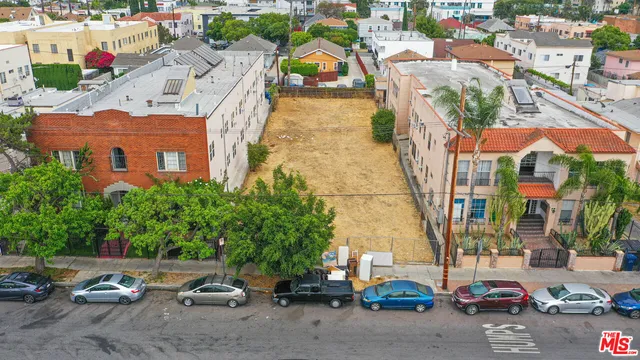 a view of multiple houses with a street