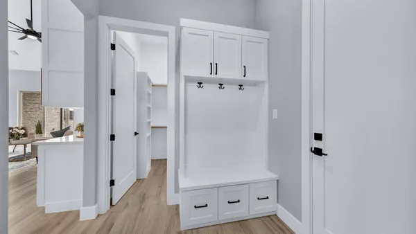 a view of utility room and bedroom