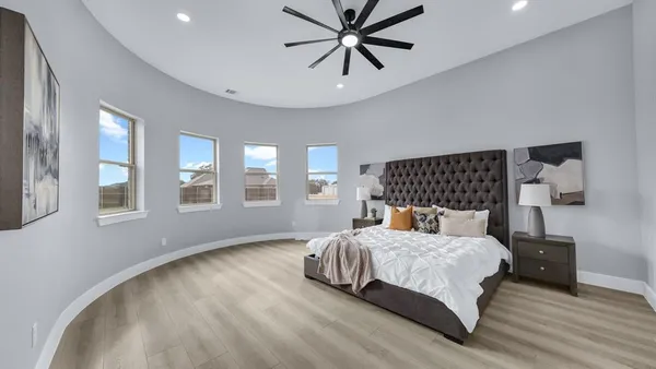 a bedroom with bed and window