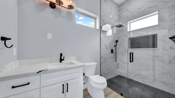 a view of an empty room with a window