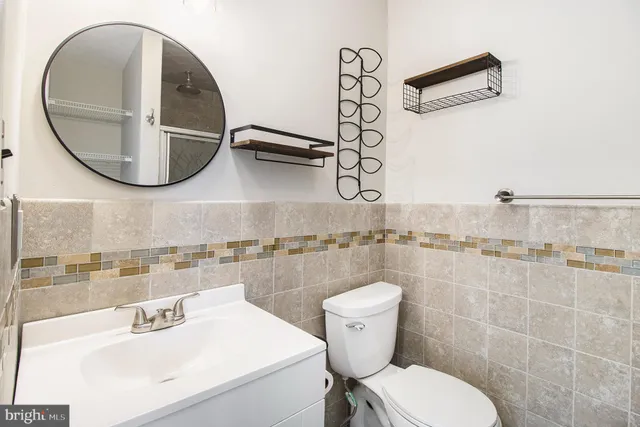 a bathroom with a glass shower door