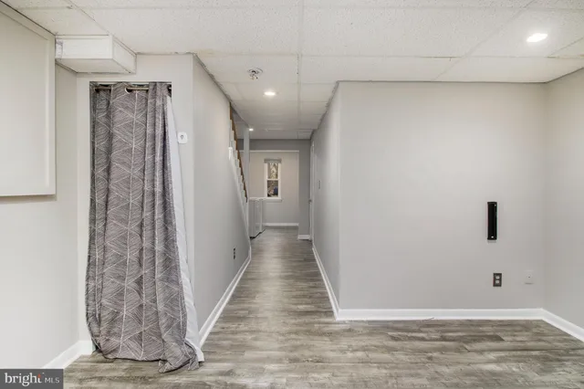 a view of a balcony with wooden floor and fence