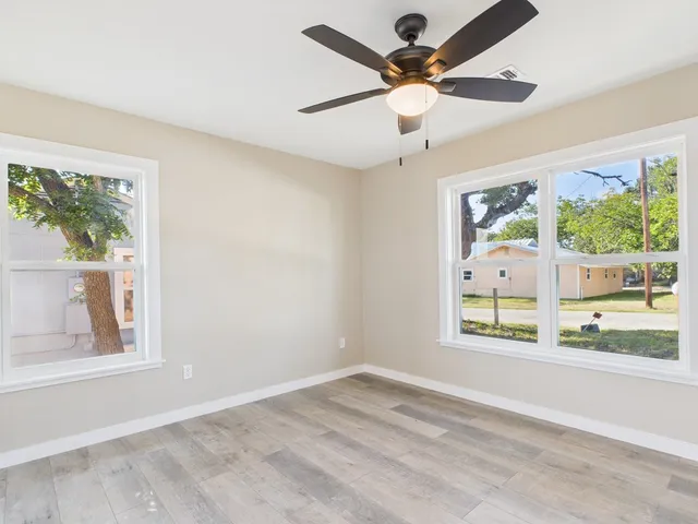 a view of an empty room with a window