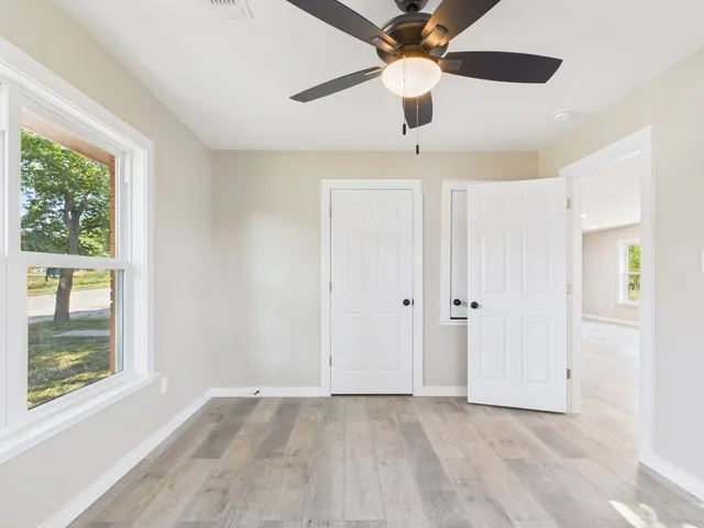 a view of an empty room with a window