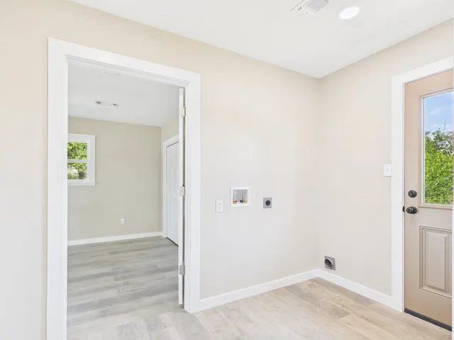 a view of a room with wooden floor and closet