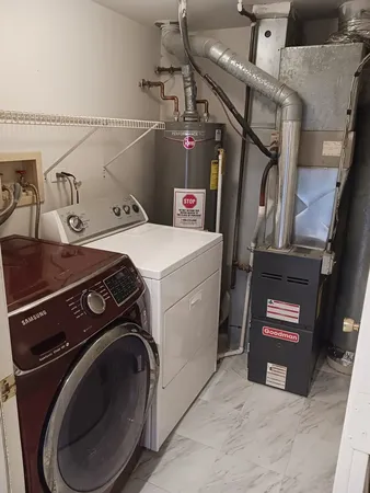 a utility room with dryer and washer