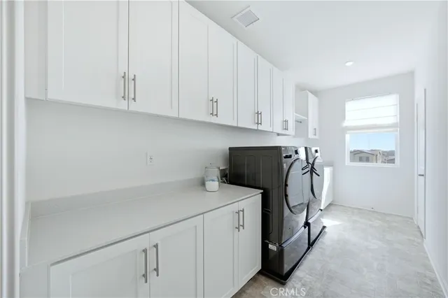 a view of an house with swimming pool and sitting area