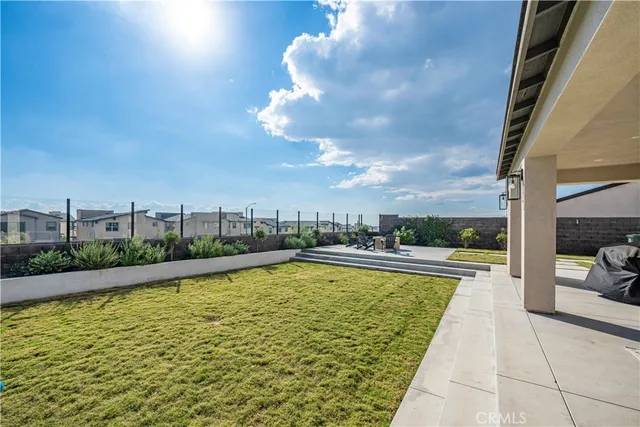 a view of a patio with couches and a table and chairs