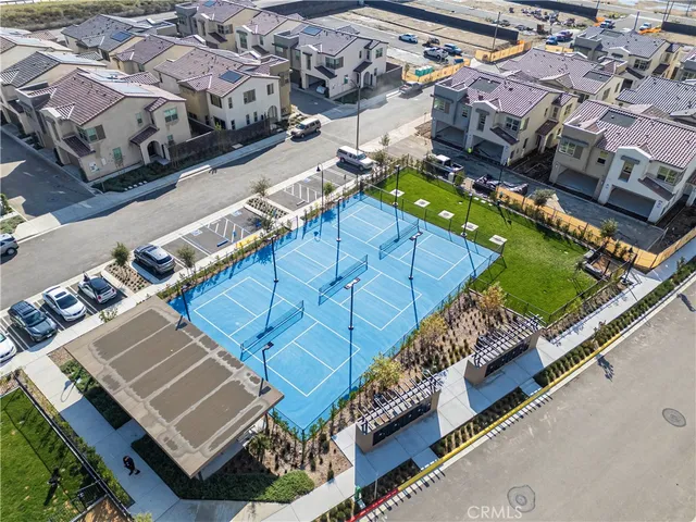 an aerial view of a residential houses with outdoor space