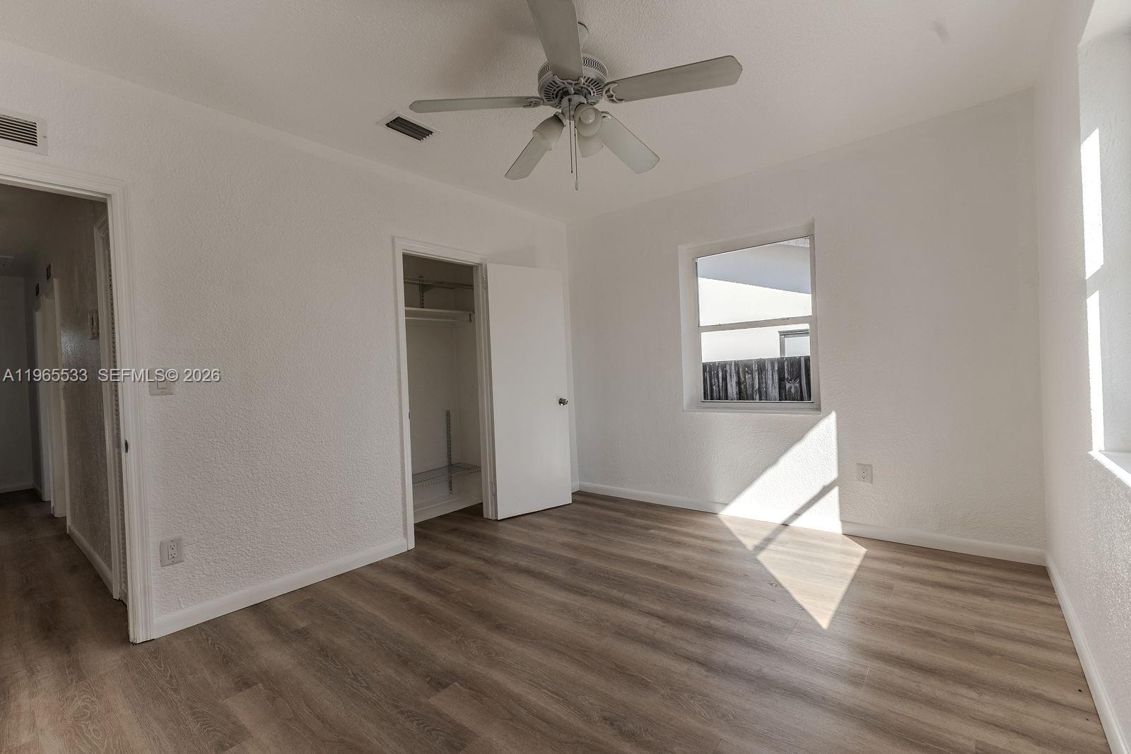1441 Southwest 17th Street Miami, FL 33145 - Photo 18 of 26 wooden floor in an empty room with a window