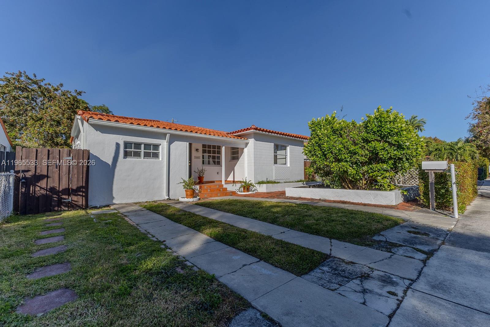 1441 Southwest 17th Street Miami, FL 33145 - Photo 2 of 26 a front view of a house with a garden