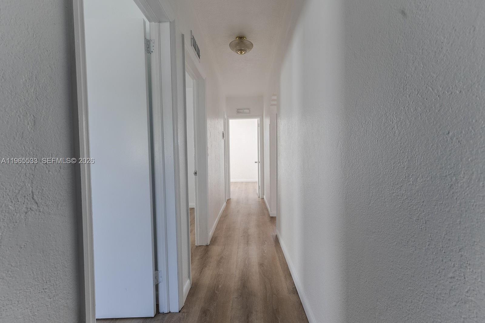 1441 Southwest 17th Street Miami, FL 33145 - Photo 21 of 26 a view of a hallway with wooden floor
