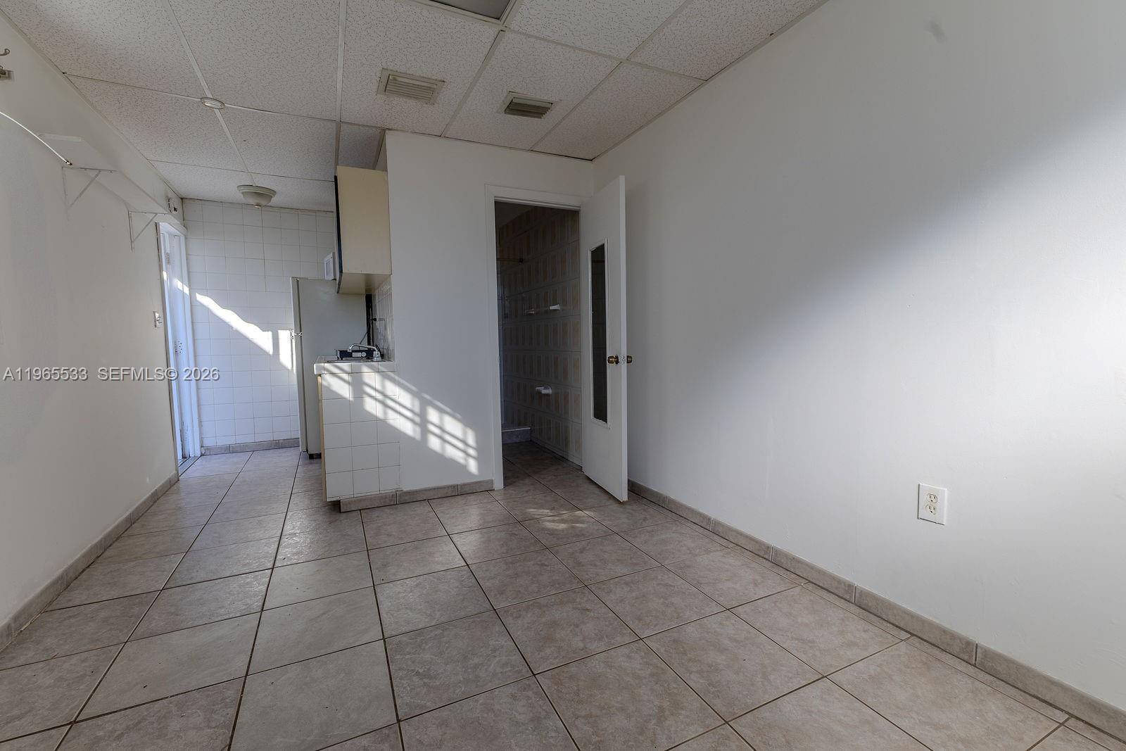 1441 Southwest 17th Street Miami, FL 33145 - Photo 26 of 26 a view of a livingroom with an empty space and a window