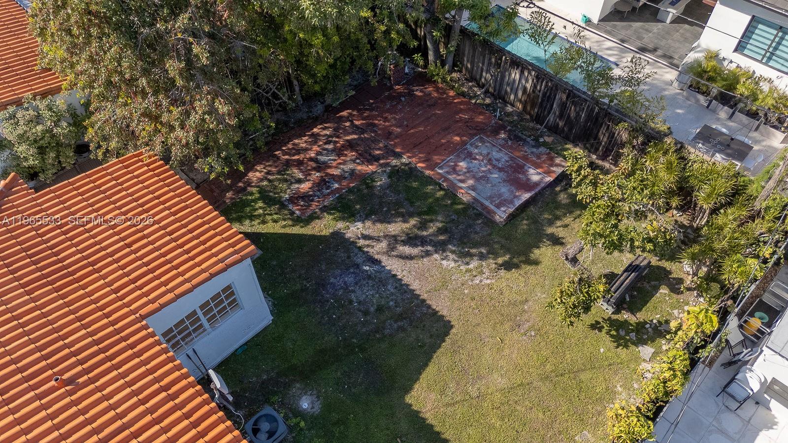 1441 Southwest 17th Street Miami, FL 33145 - Photo 6 of 26 a backyard of a house with a yard and trees