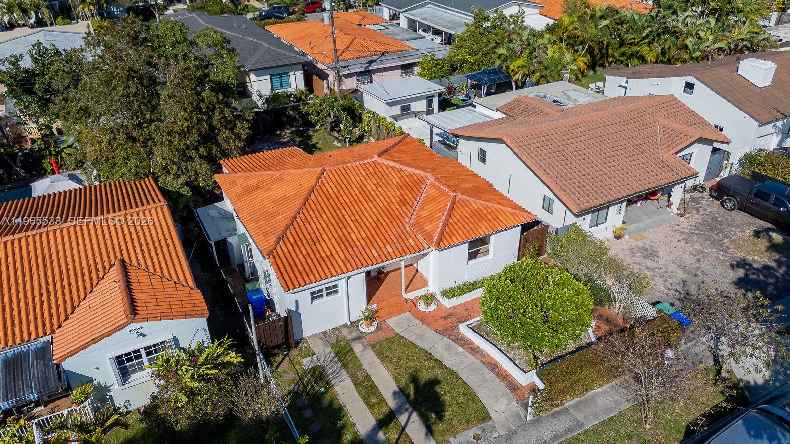 1441 Southwest 17th Street Miami, FL 33145 - Photo 7 of 26 an aerial view of a house with balcony and trees al around