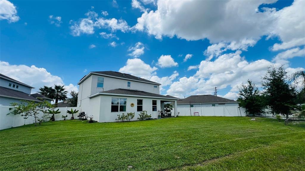 1257 Castlevecchio Loop Orlando, FL 32825 - Photo 3 of 12 a view of a house with backyard and garden
