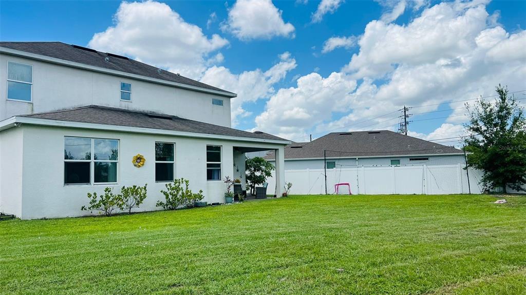 1257 Castlevecchio Loop Orlando, FL 32825 - Photo 5 of 12 a front view of house with yard and green space
